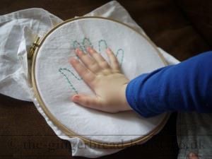 embroidered handprint