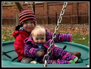 children on a swing at the park