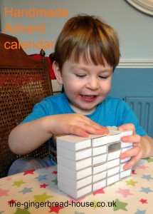 toddler making a matchbox Advent calendar