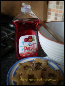 Persil warm spice next to a mixing bowl and plate of biscuits