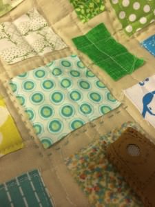 ticker tape quilt with hand quilting