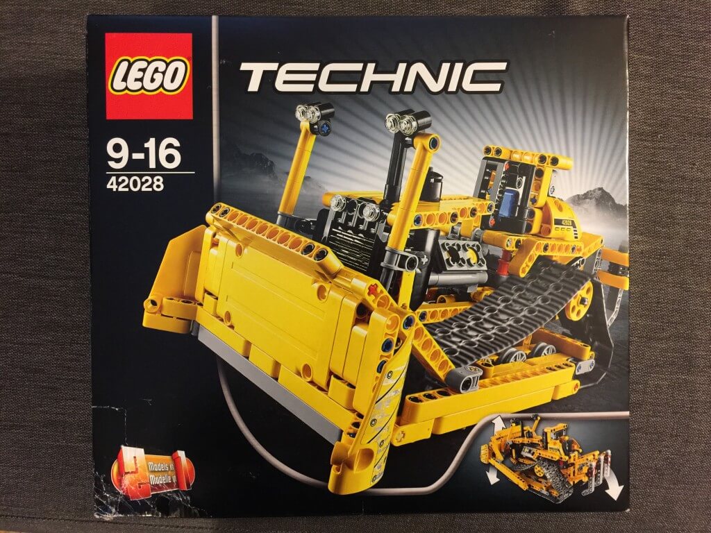 Box of Lego Technic bulldozer set