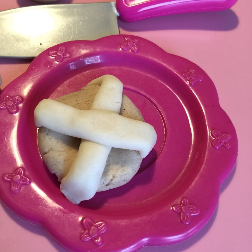 play dough hot cross bun on plate
