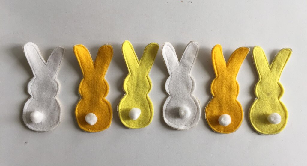 row of felt Easter bunnies with tails