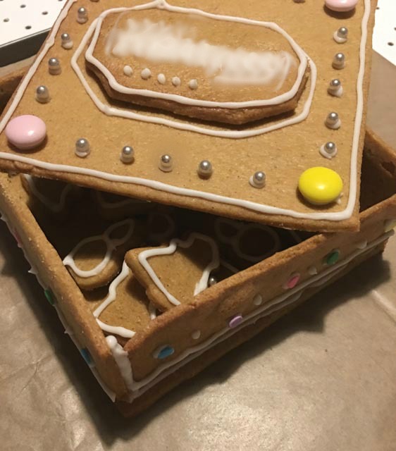 gingerbread biscuit box with iced gingerbread biscuits inside