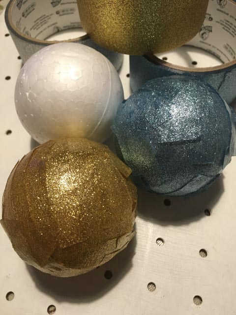 balls covered in Duck Glitter tape