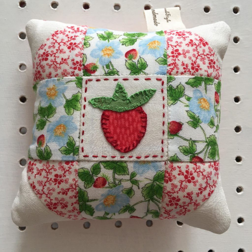 patchwork pincushion with strawberry
