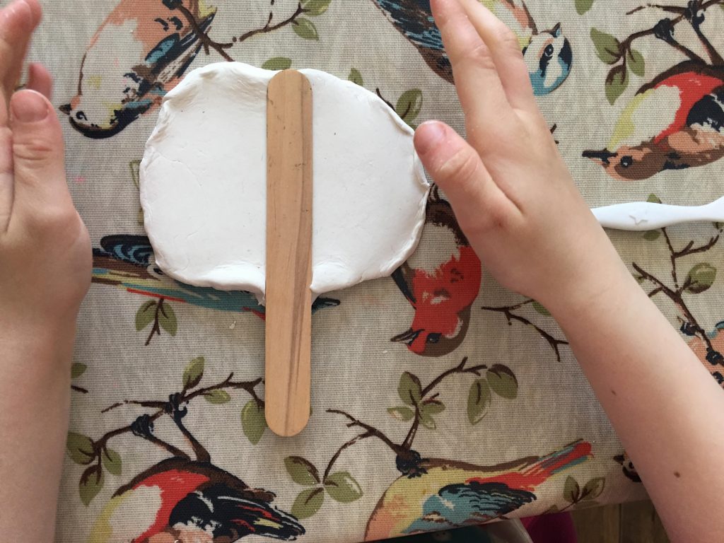 child playing with air drying clay