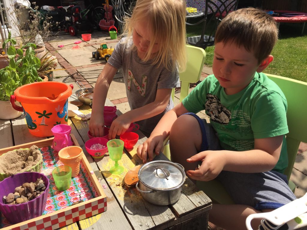 playing at the mud kitchen