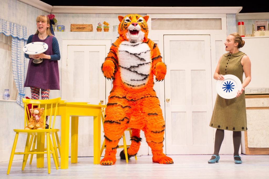 London, UK. 03.07.2014. THE TIGER WHO CAME TO TEA roars into the West End. Adapted from Judith Kerr's book, and directed by, David Wood, the children's show opens at the Lyric Theatre, Shaftesbury Avenue. Abbey Norman plays the little girl, Sophie, Jenanne Redman, her mummy, and Matthew Dudley, the tiger, Sophie's daddy, the Milkman and the Postman. Photograph © Jane Hobson.