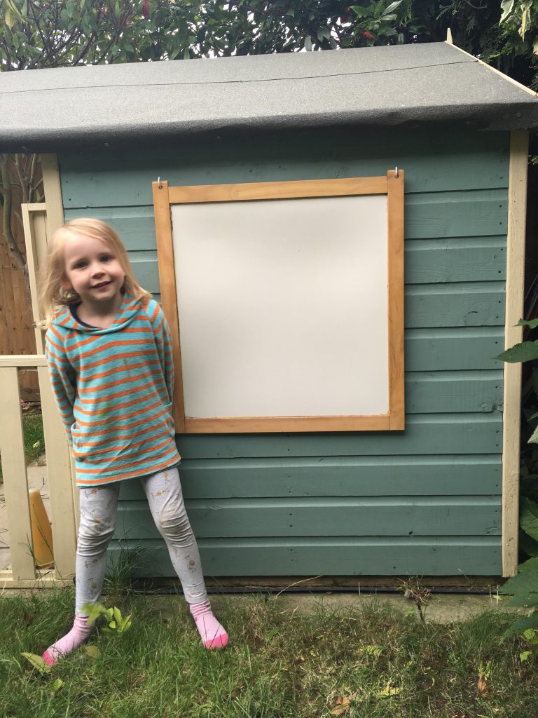 Customising our children's playhouse with a blackboard
