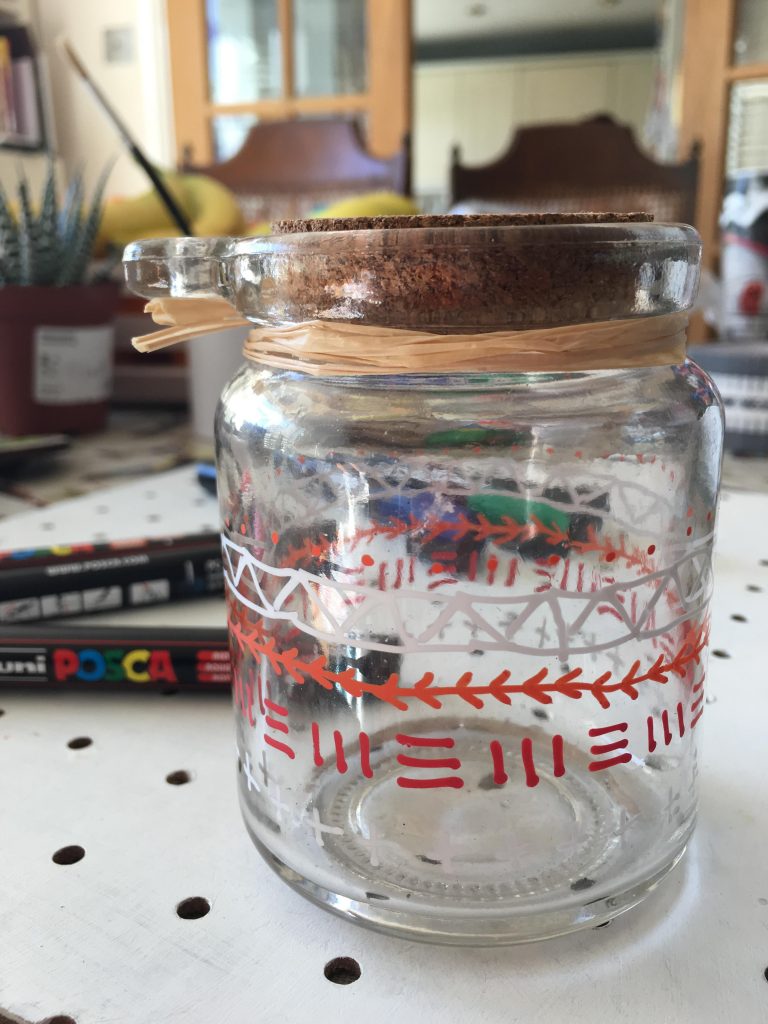 decorating a glass jar iwth Posca pens